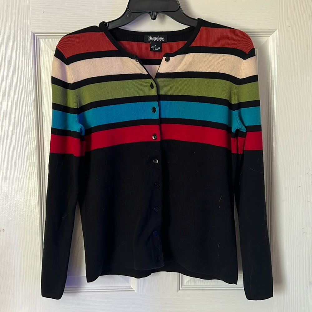 The size is a small but also fits medium! Beautifully made sweater.